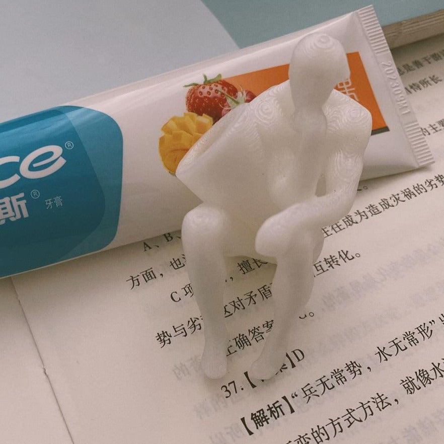 The Thinker Toothpaste Dispenser Cap