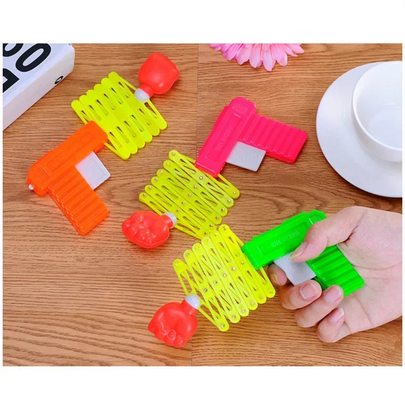 Retractable Fist Shooting Gun Toy