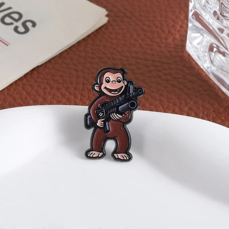 George The Monkey Holding a Gun Enamel Pin