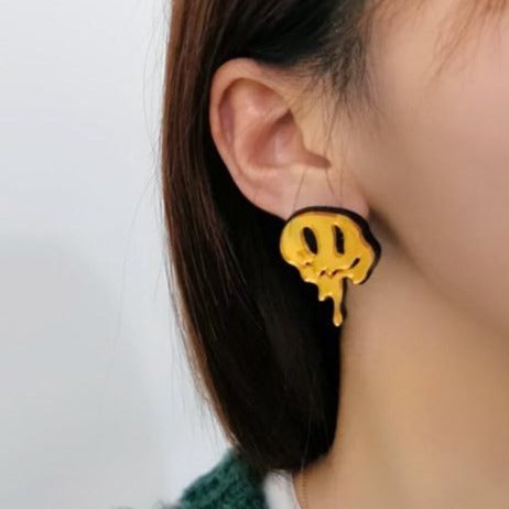 Melted happy face earring